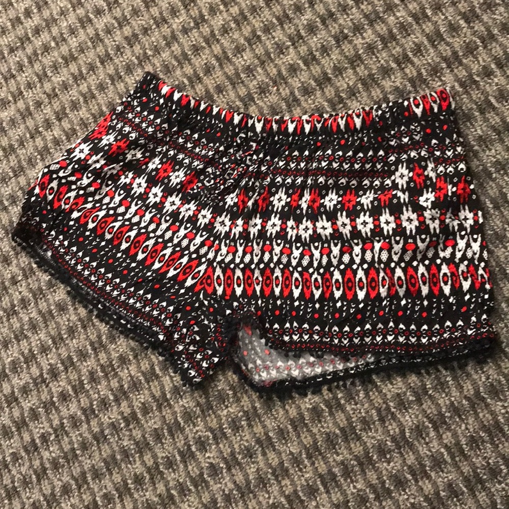 red festival shorts with small tassels